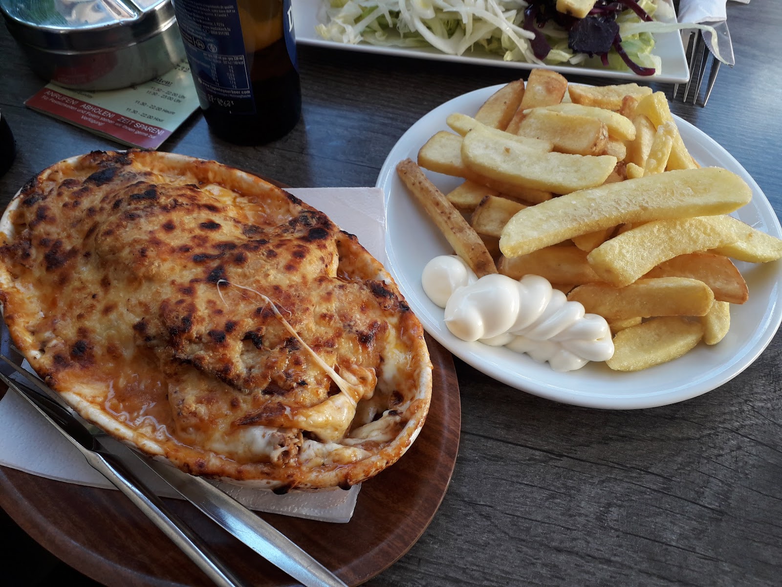 Oven-baked gratin plate with fries